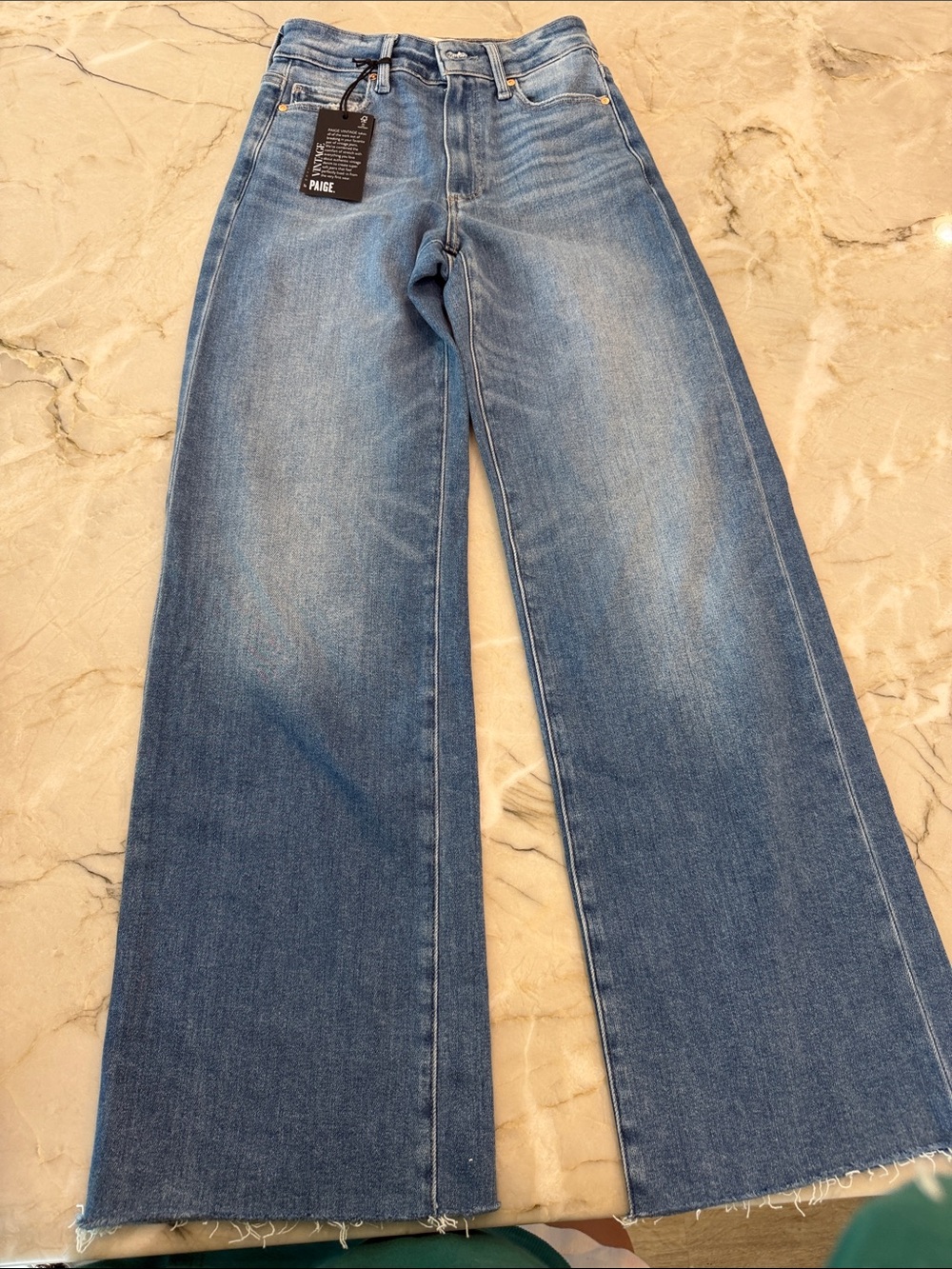PAIGE Wide Leg High-Rise Jeans in Light Blue Wash